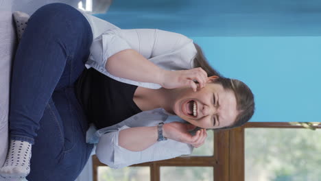 Vertical-video-of-Woman-having-a-nervous-breakdown-by-the-wall.